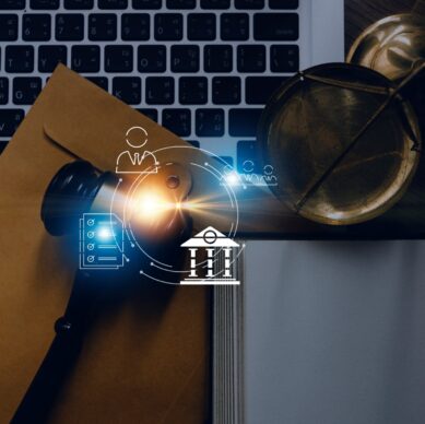Justice and law concept.Male judge in a courtroom with the gavel, working with, computer and docking keyboard, eyeglasses, on table in morning light